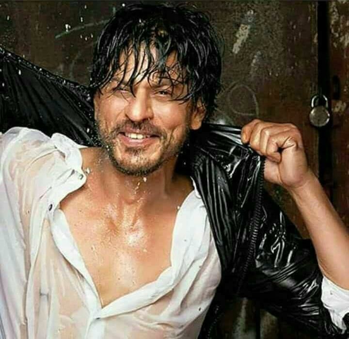 Smiling Shahrukh Khan in black jacket with white shirt enjoying rain - Shahrukh khan hair look