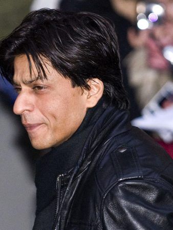 Shahrukh Khan in black jacket with black high neck inner - Shahrukh khan hairstyle name
