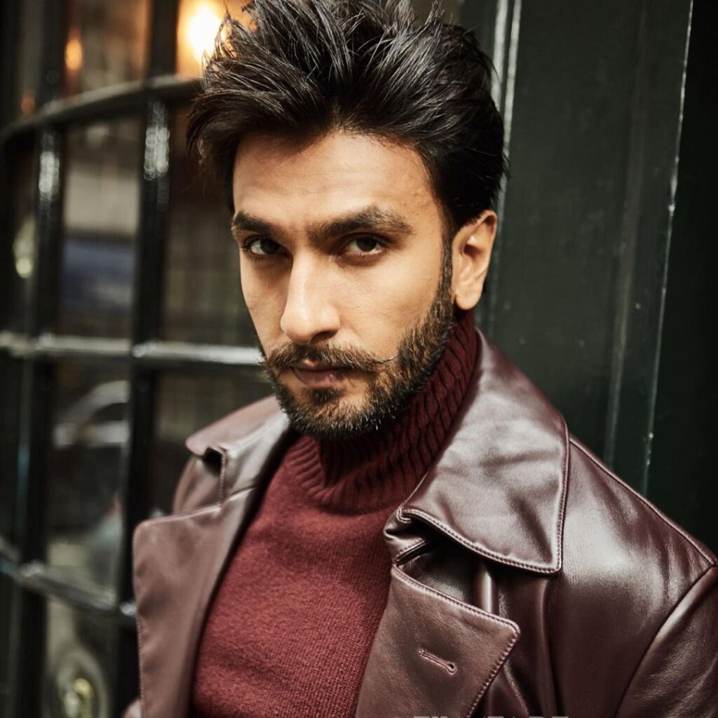 Ranveer Singh in brown leather jacket with matching high neck pullover - Ranveer Singh beard styles
