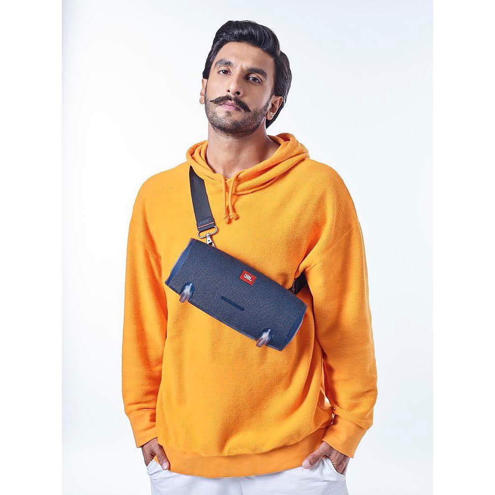 Ranveer Singh i yellow sweatshirt and short bag and Prominent thick twisted mustache and a stubble beard - Ranveer Singh hairstyles