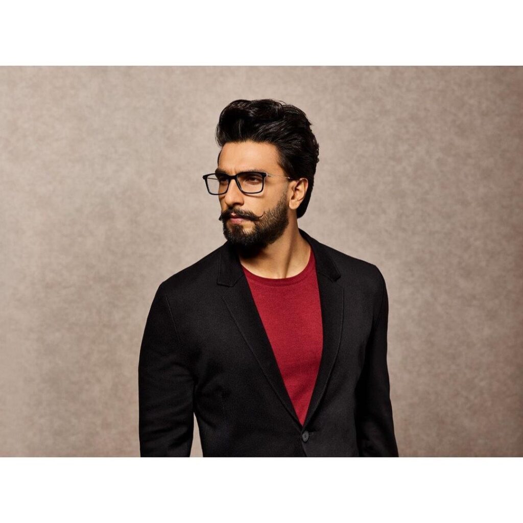 Ranveer Singh in black blazer with maroon t-shirt and spectacles -  Ranveer Singh beard look