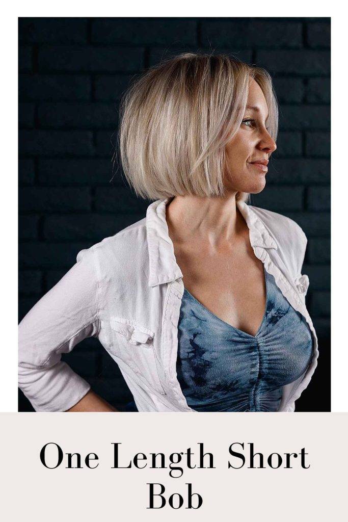 Woman in white shirt and blue top with One Length Short Bob hairstyle - bob hairstyles for long faces