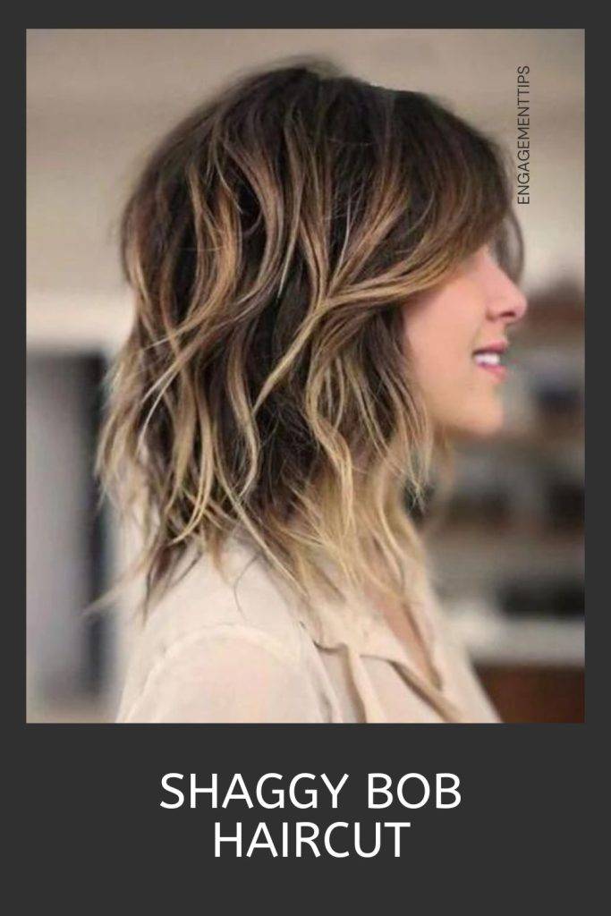 Woman in off white shirt and shaggy bob haircut - shag haircut long