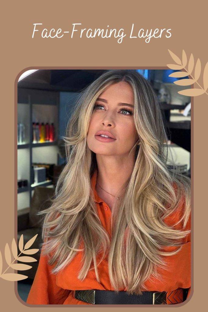 Woman in orange shirt and Face-Framing Layers hairstyle - layered haircuts for long hair