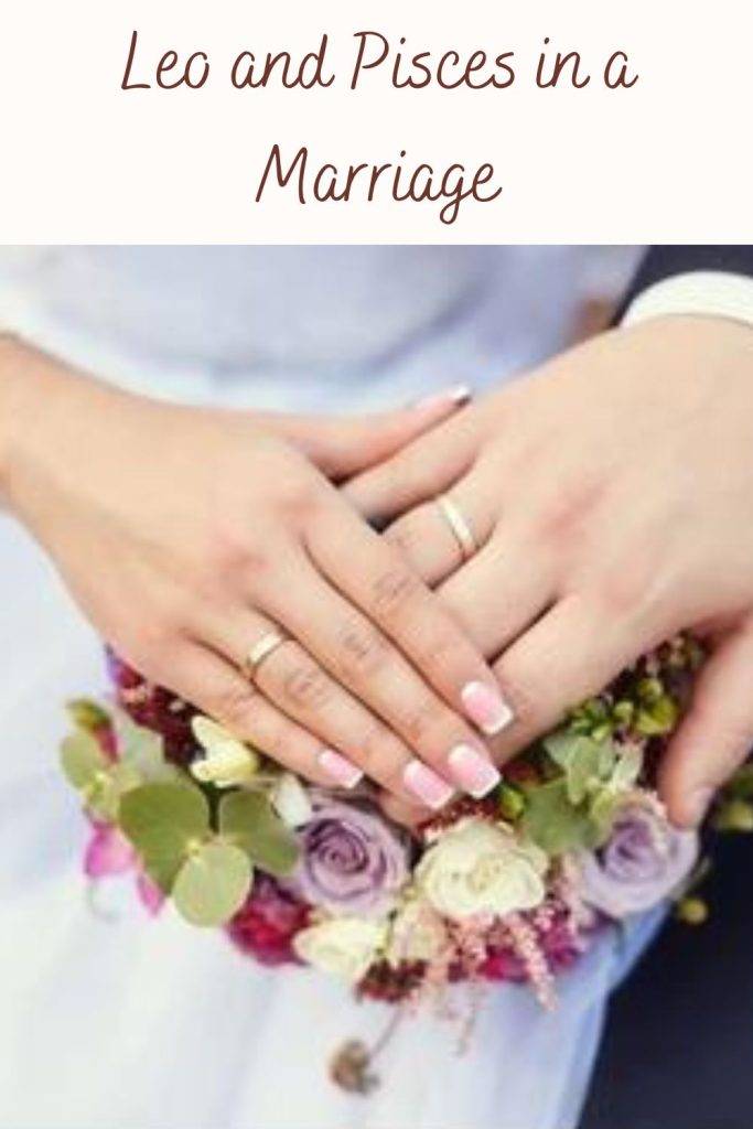 A newly married couple showing their  wedding rings - compatibility of Leo and Pisces