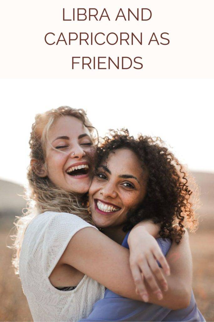 2 friends laughing and hugging each other 2 friends laughing and hugging each other - Libra and Capricorn compatibility friendship