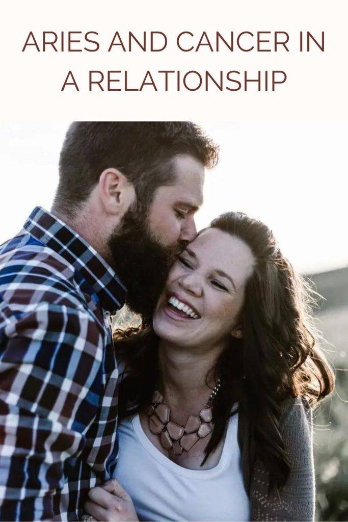 A man is kissing his lady love A man is kissing his lady love - compatibility of Aries and cancer