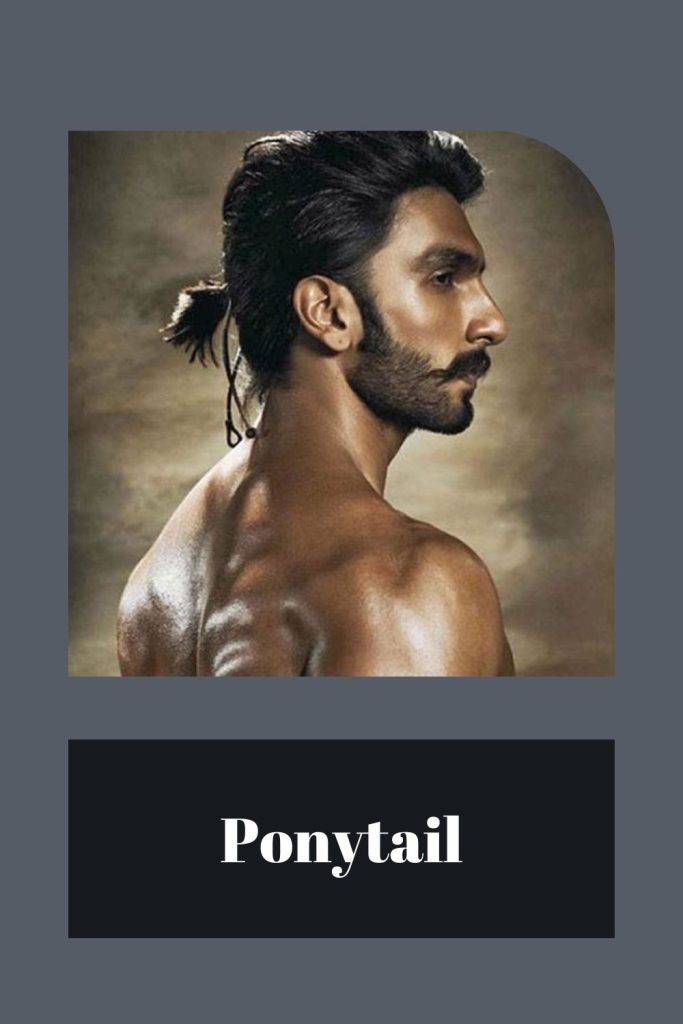 Shirtless man showing the side view of his low Ponytail - Men long haircut