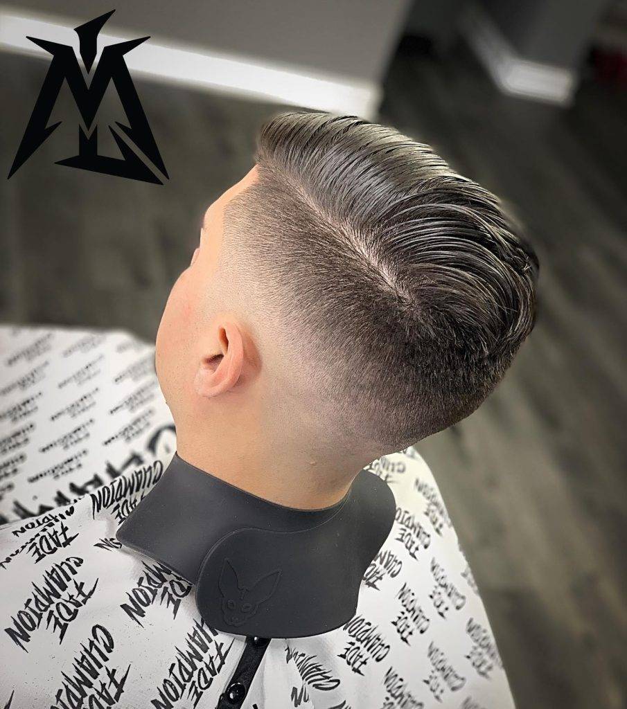 back view of high fade comb over hairstyle