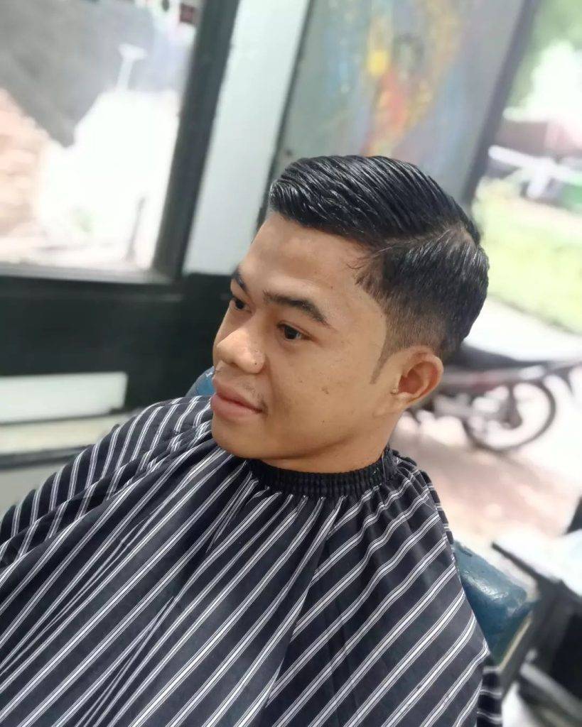 side view of low fade comb over hairstyle