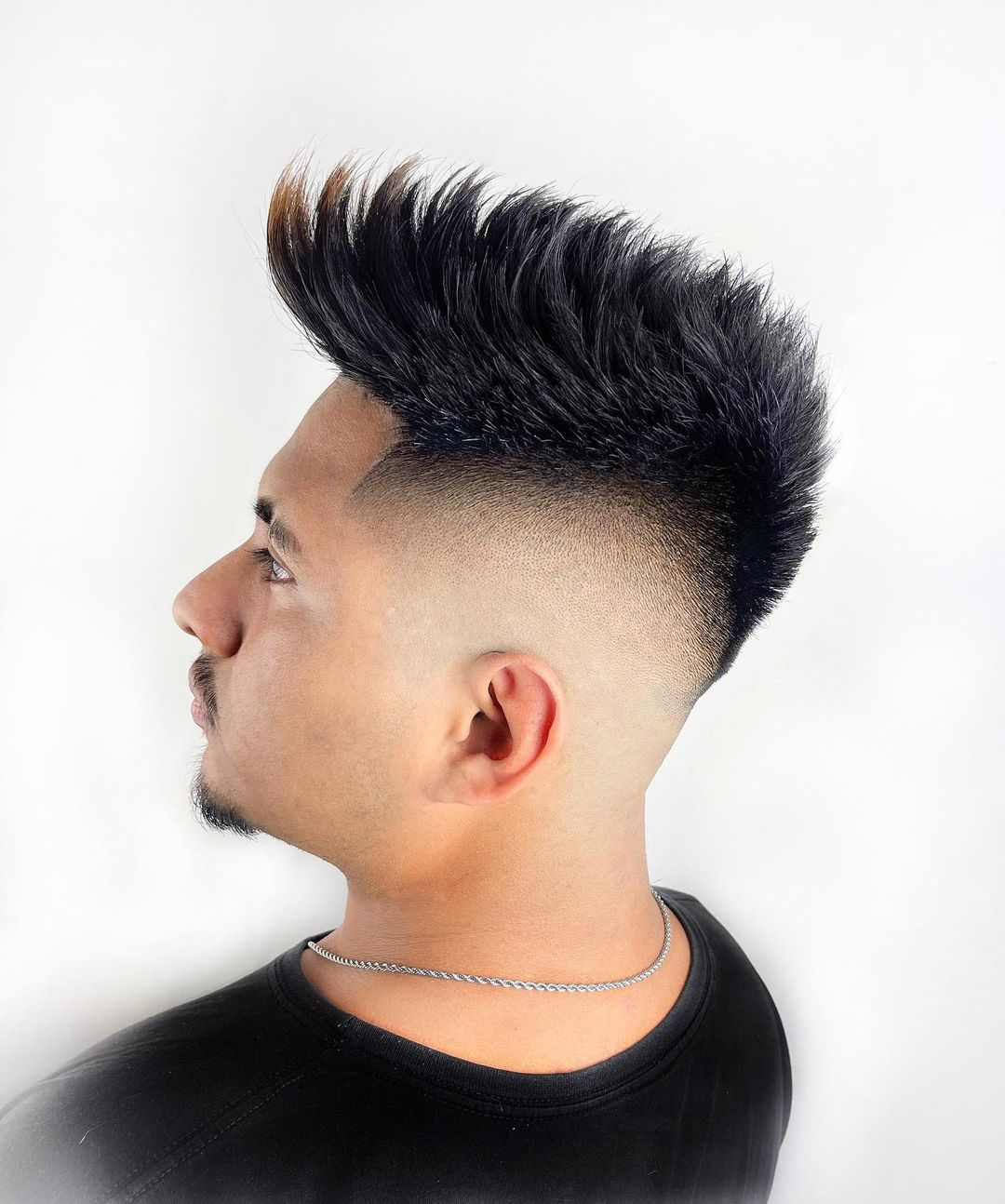 long spiky faux hawk hairstyle for men