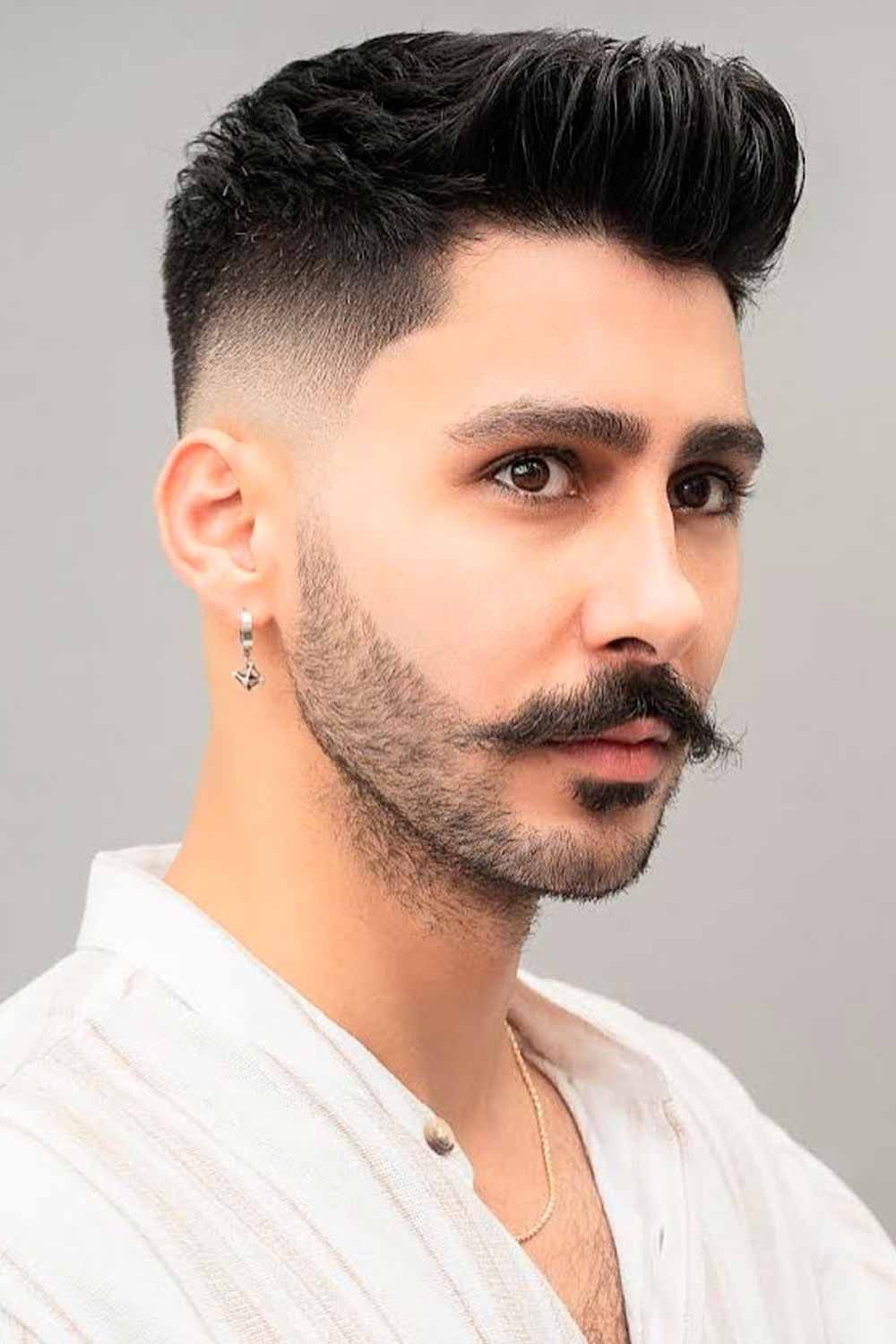 high fade classy faux hawk hairstyle for men