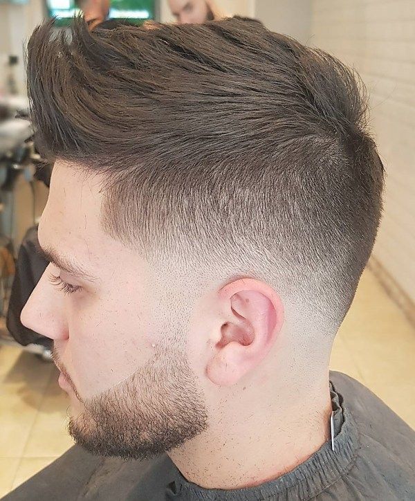 spiky mid fade faux hawk hairstyle