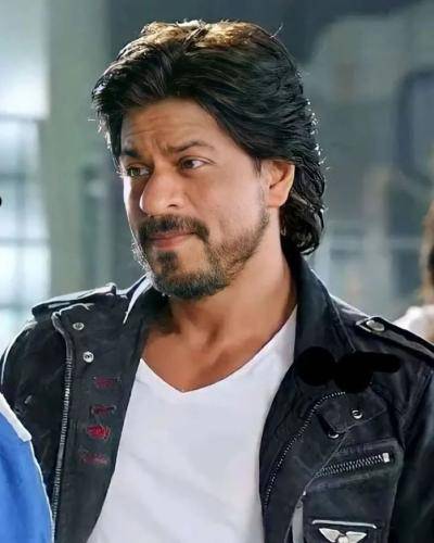Shahrukh khan in black jacket with white t-shirt and side parted medium hairstyle