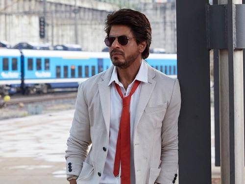 Shahrukh khan in white shirt and goggles with medium hair