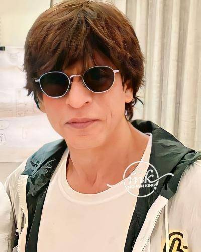 Shahrukh khan in Black jacket with white t-shirt and googles in messy medium hair