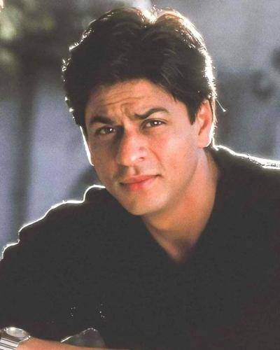 Shahrukh khan in black shirt and medium hair