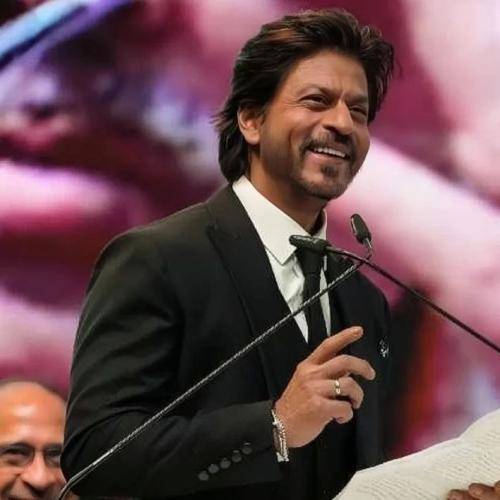Shahrukh khan in black suit with white shirt and medium hair