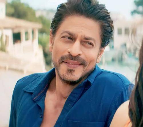 Shahrukh khan in blue shirt with ponytail hairstyle