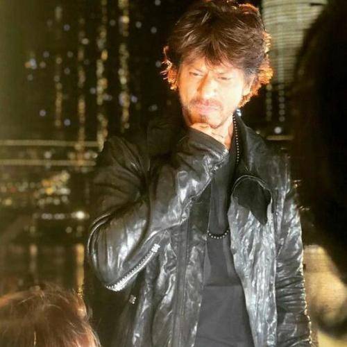 Shahrukh khan in black jacket and messy medium hairstyle