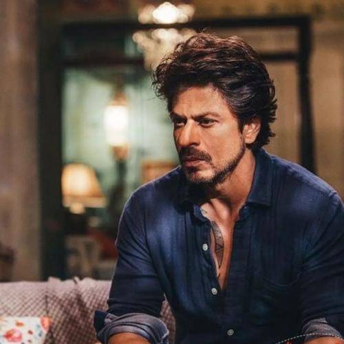 Shahrukh khan in blue shirt and medium hairstyle with beard