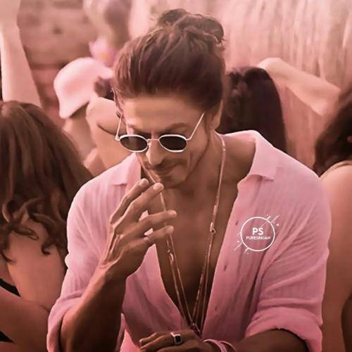 Shahrukh khan in pink shirt with goggles and men bun