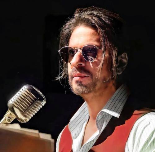 Shahrukh khan in lining shirt with messy ponyutail