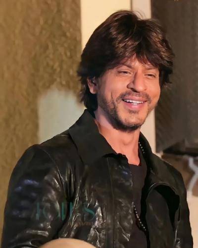 Shahrukh khan in black shirt and  messy medium regular hairstyle