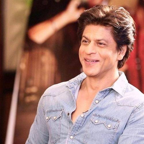 Shahrukh khan in blue denim shirt and gelled hairstyle