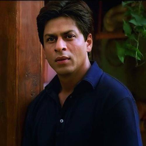 Shahrukh khan in blue shirt and regular hairstyle