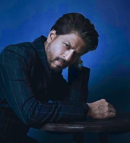 Shahrukh khan in complete black outfit with slicked back hairstyle