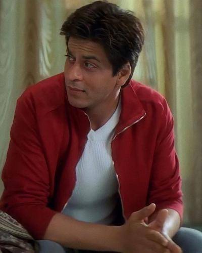 Shahrukh khan in red jacket with white t-shirt and short hairstyle