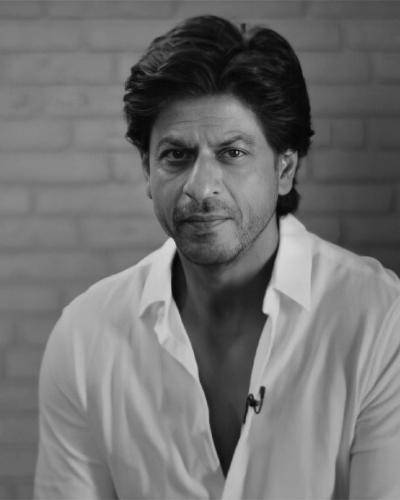 Shahrukh khan in white shirt and regular medium hairstyle