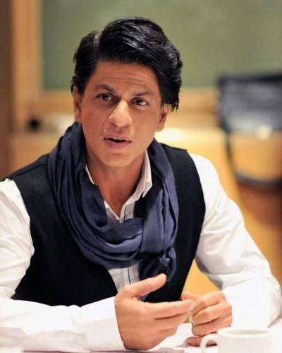 Shahrukh khan in white shirt with black waist coat and regular medium hairstyle