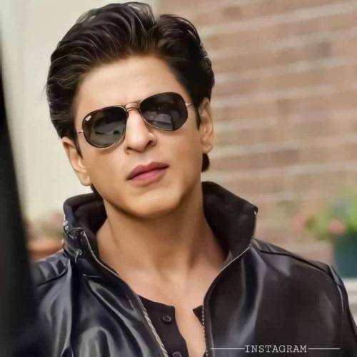 Shahrukh khan in black jacket with goggles with gelled hair