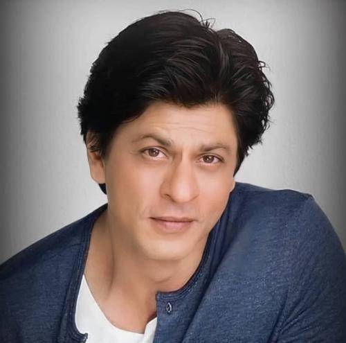 Shahrukh khan in blue t-shirt and side parted medium hairstyle