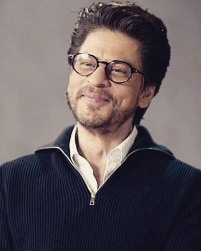 Shahrukh khan in black jacket with spectacles and regular hairstyle