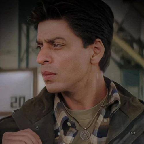 Shahrukh khan in black jacket and lining shirt and regular short hairstyle